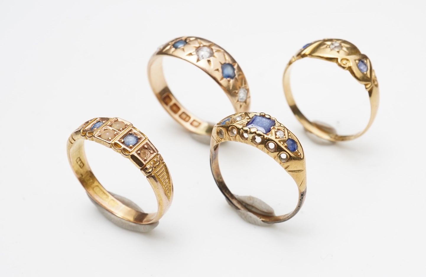 A group of four sapphire rings, late 19th/early 20th century